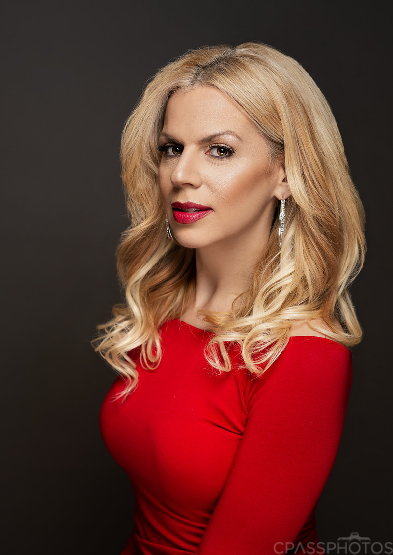 portrait of Glamour Jessica with a red shirt looking into the camera